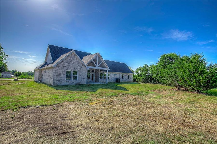 Front exterior of a new home in , Farmersville, TX, highlighting curb appeal (Image 2).
