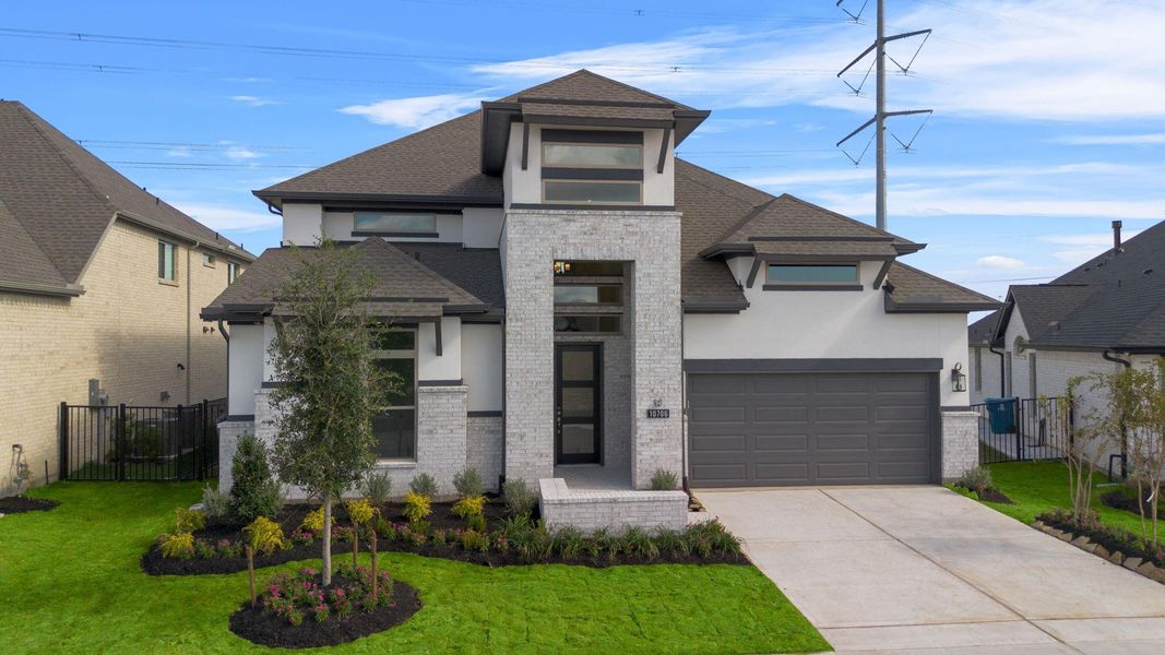 Front exterior of a new home in Bridgeland 55', Cypress, TX, highlighting curb appeal (Image 2).