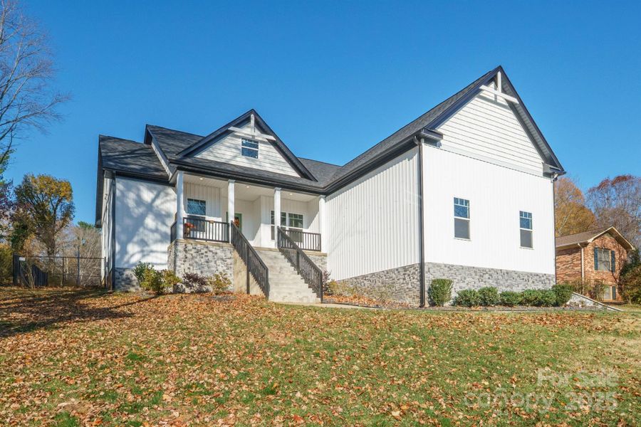 Front exterior of a new home in , Statesville, NC, highlighting curb appeal (Image 1).