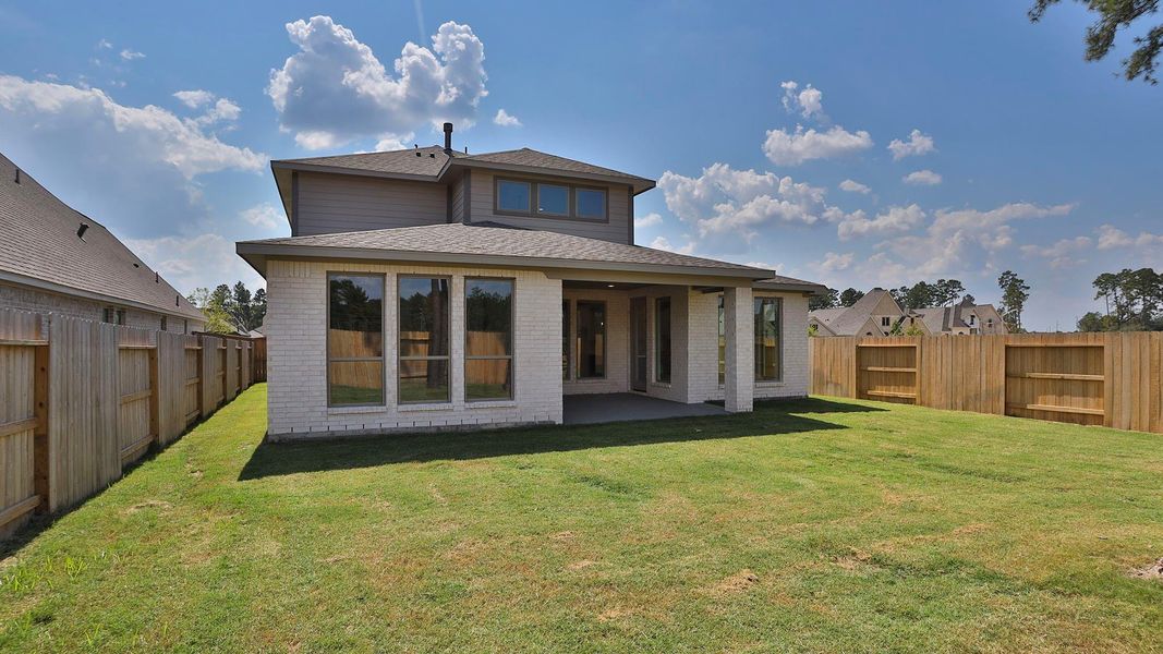 Front exterior of a new home in Evergreen 50', Conroe, TX, highlighting curb appeal (Image 2).