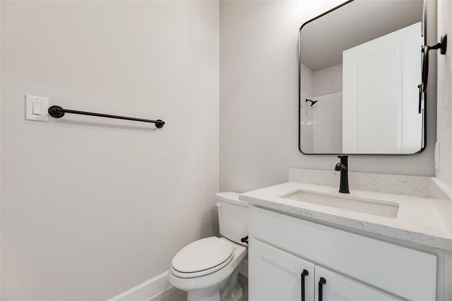 Bathroom featuring vanity and a shower Bathroom featuring vanity and a shower