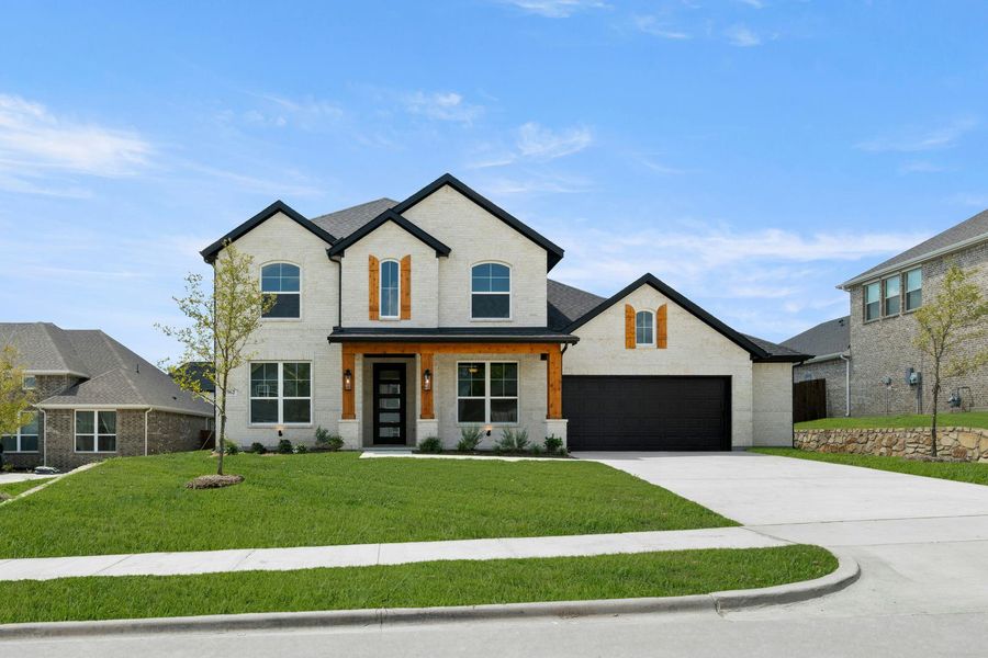 Front exterior of a new home in Kentsdale Farms, DeSoto, TX, highlighting curb appeal (Image 2).