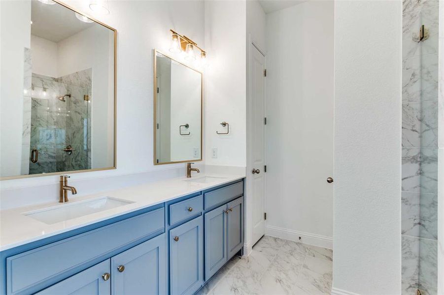 Bathroom with vanity and walk in shower