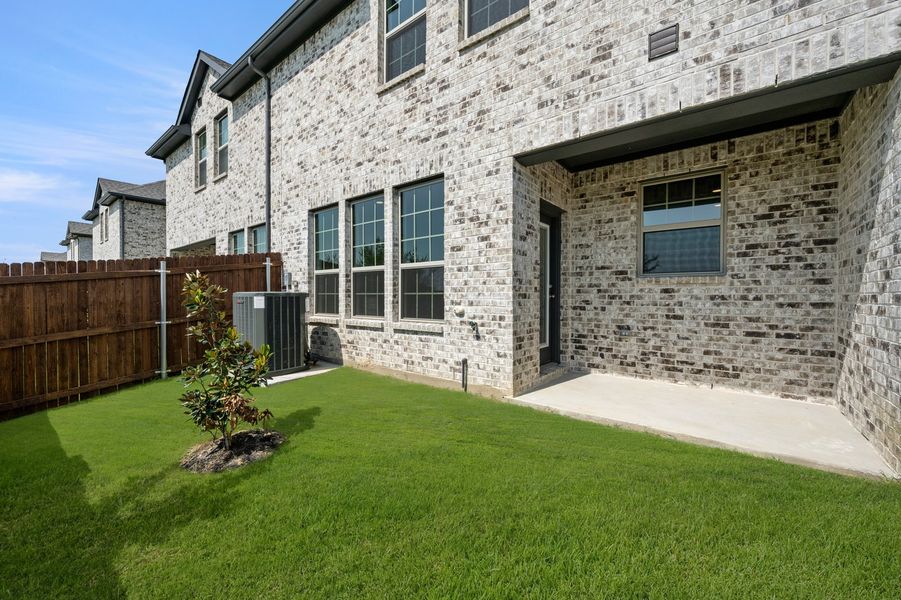 Front exterior of a new home in Main Street Village, Mansfield, TX, highlighting curb appeal (Image 27). Front exterior of a new home in Main Street Village, Mansfield, TX, highlighting curb appeal (Image 27).