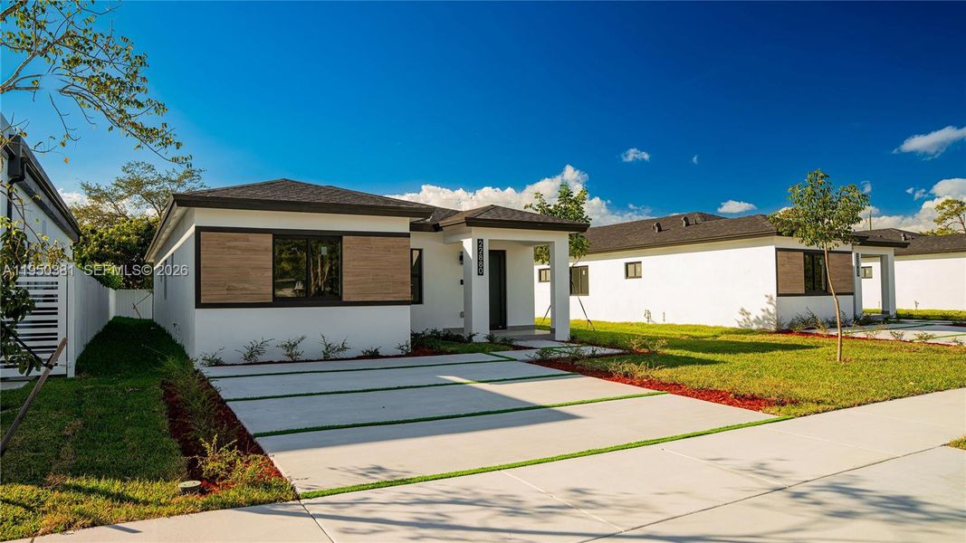 Front exterior of a new home in , Miami, FL, highlighting curb appeal (Image 25).