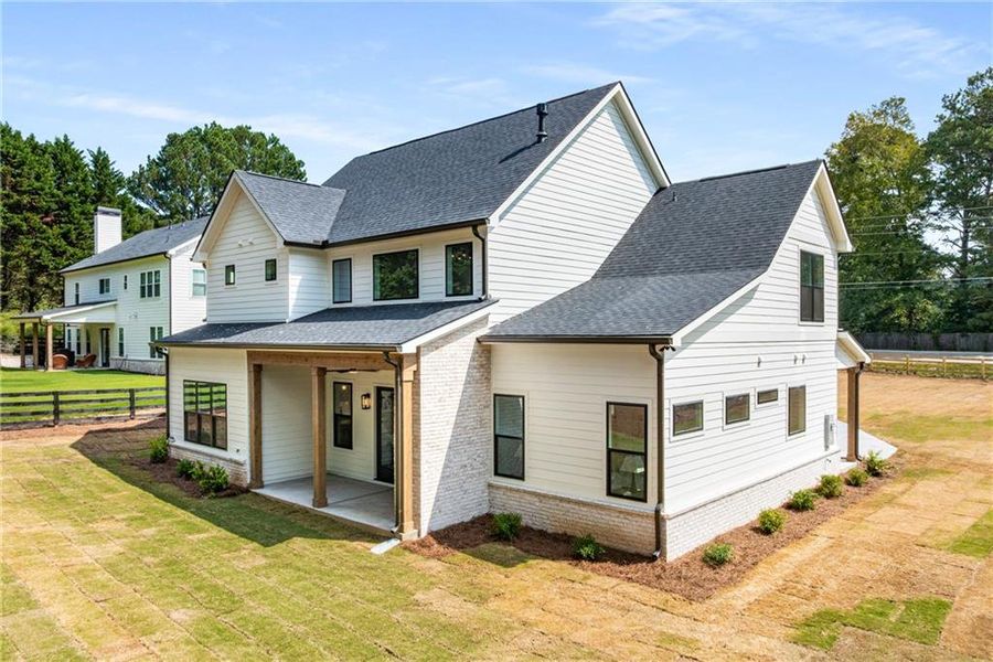 Front exterior of a new home in , Alpharetta, GA, highlighting curb appeal (Image 1). Front exterior of a new home in , Alpharetta, GA, highlighting curb appeal (Image 1).
