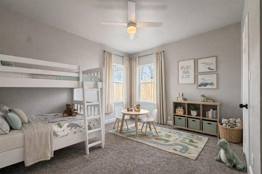 Carpeted bedroom with a ceiling fan