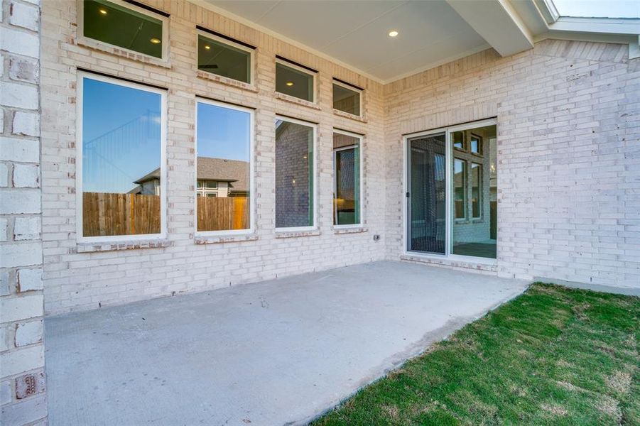 Exterior details and patio area of a home in West Crossing, Anna (Image 4). Exterior details and patio area of a home in West Crossing, Anna (Image 4).