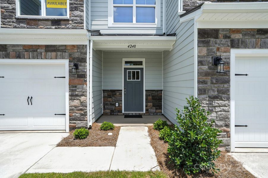 Front exterior of a new home in Harrisburg Village Townhomes, Harrisburg, NC, highlighting curb appeal (Image 22).