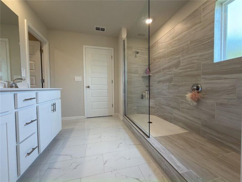 Furnished interior view inside a new home in Martin Springs - Estate Series, Lawrenceville (Image 10).