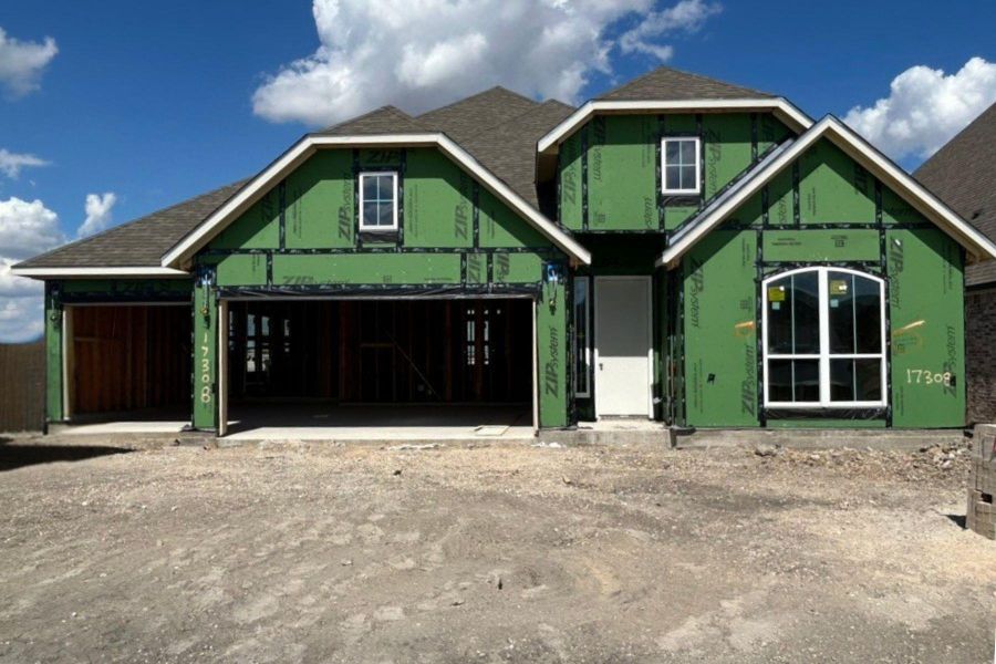 Unfinished property featuring roof with shingles