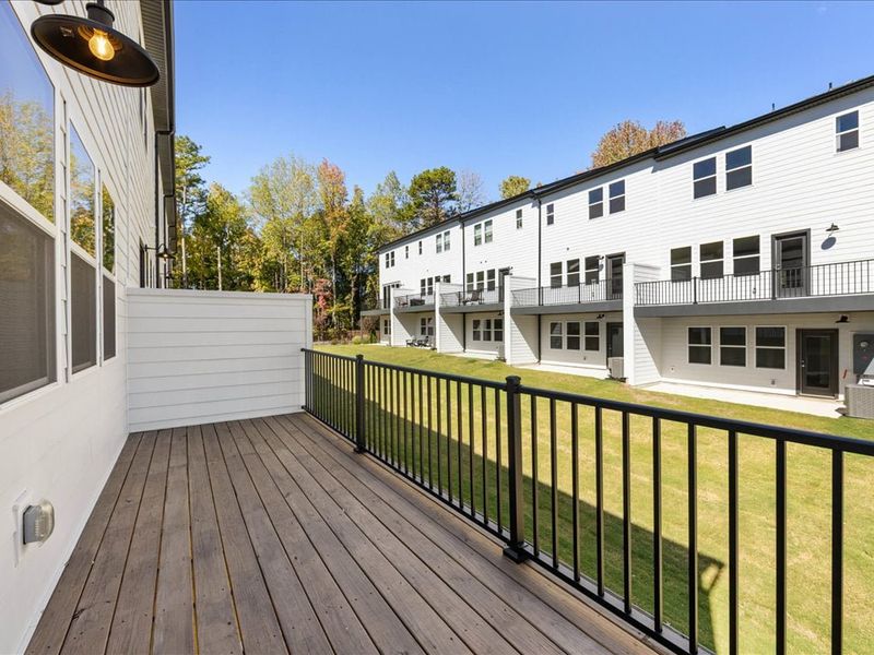 Exterior details and patio area of a home in Archer Row, Charlotte (Image 1).