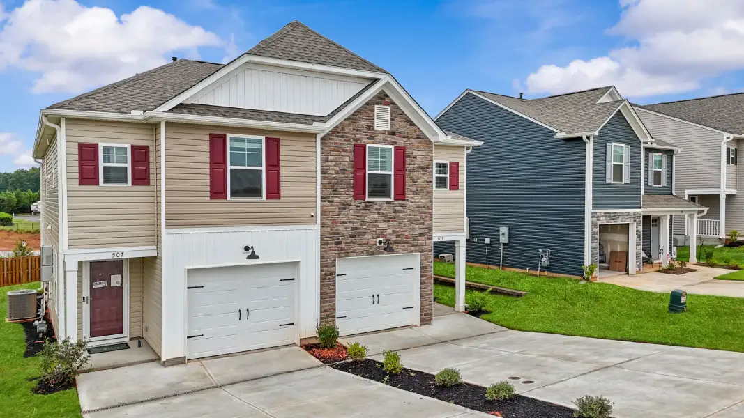 Front exterior of a new home in Champions Village at Cherry Hill, Pendleton, SC, highlighting curb appeal (Image 28).