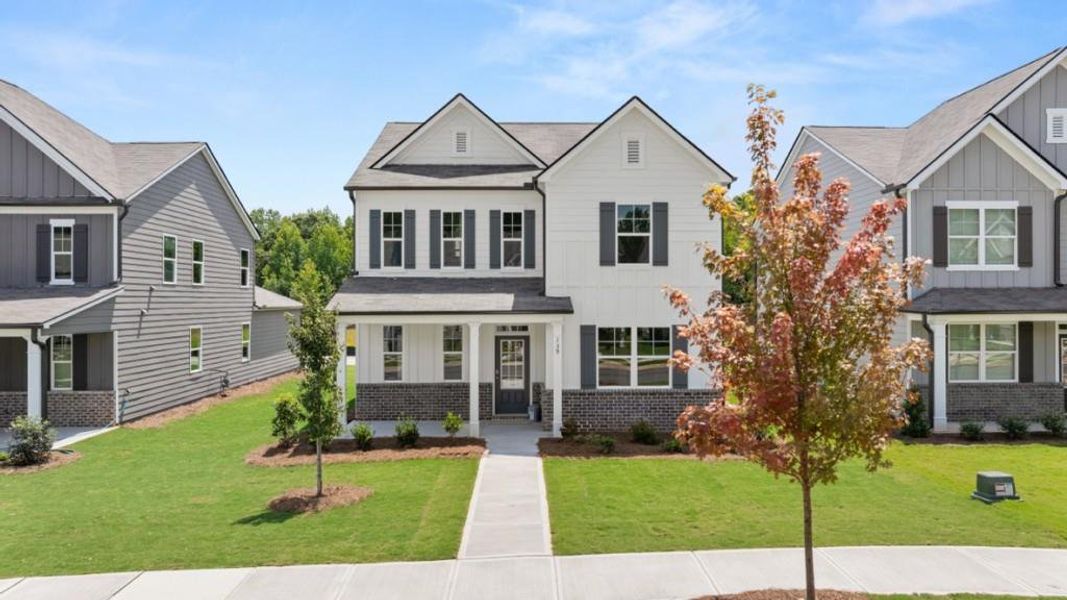 Front exterior of a new home in Braselton Village, Braselton, GA, highlighting curb appeal (Image 17).