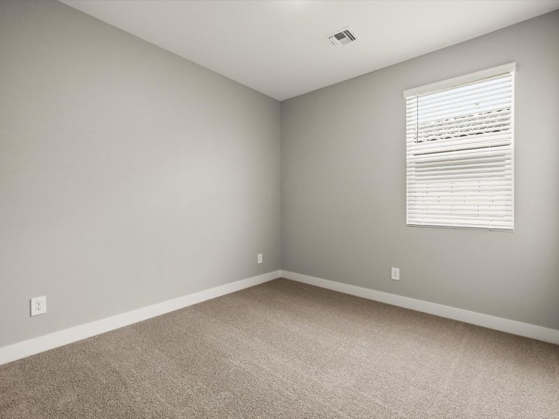 Spacious, unfurnished interior of a new home in White Tank Foothills Reserve Series, Waddell (Image 8).