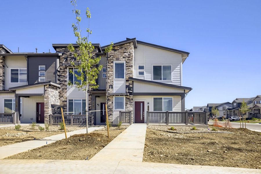 Front exterior of a new home in Riano Ridge, Loveland, CO, highlighting curb appeal (Image 1). Front exterior of a new home in Riano Ridge, Loveland, CO, highlighting curb appeal (Image 1).