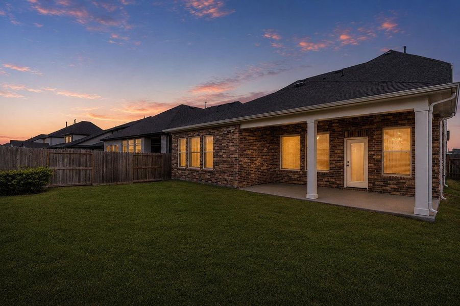 Exterior details and patio area of a home in Towne Lake 50', Cypress (Image 24).