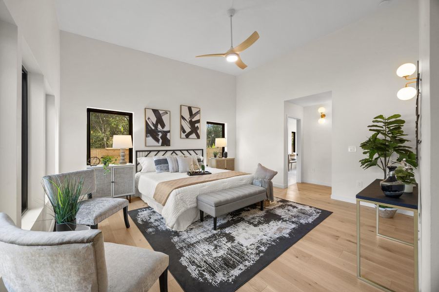 Primary bedroom with high ceilings and natural light Primary bedroom with high ceilings and natural light