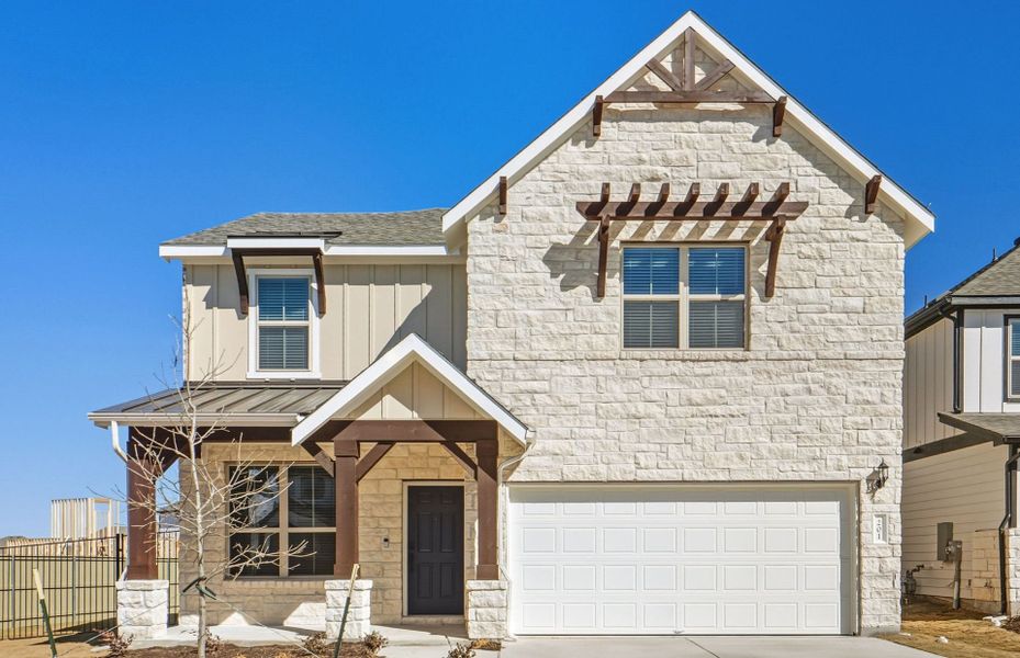Front exterior of a new home in Santa Rita Ranch, Liberty Hill, TX, highlighting curb appeal (Image 23).
