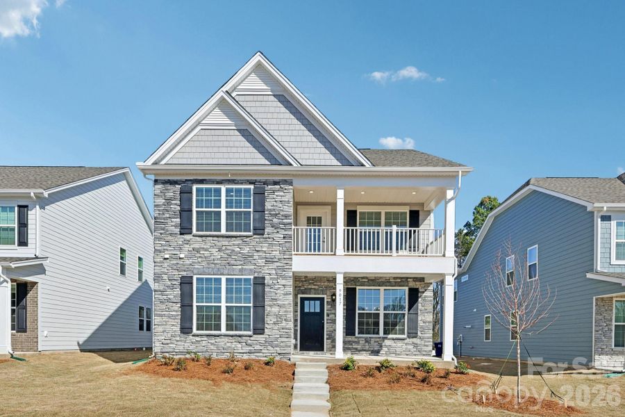 Front exterior of a new home in Oak Grove Hill, Huntersville, NC, highlighting curb appeal (Image 1). Front exterior of a new home in Oak Grove Hill, Huntersville, NC, highlighting curb appeal (Image 1).