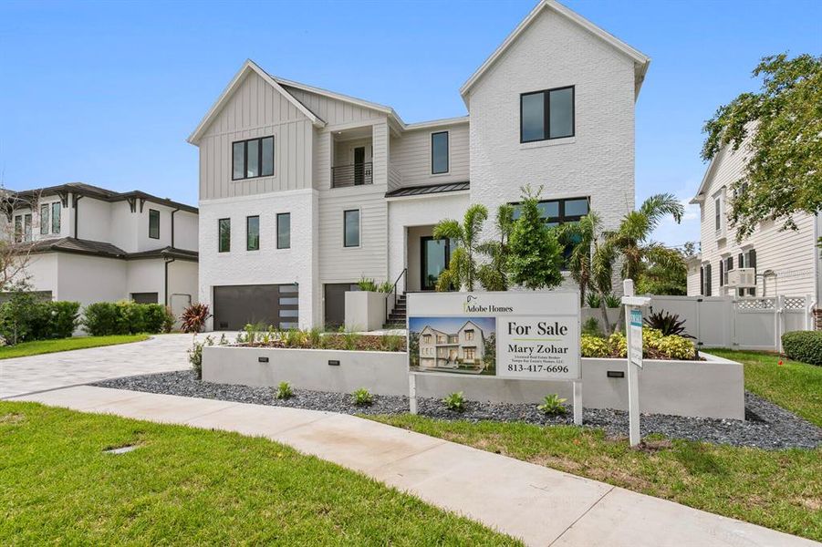 Front exterior of a new home in , Tampa, FL, highlighting curb appeal (Image 31).