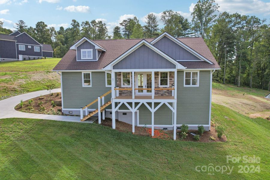 Front exterior of a new home in , Hendersonville, NC, highlighting curb appeal (Image 26). Front exterior of a new home in , Hendersonville, NC, highlighting curb appeal (Image 26).