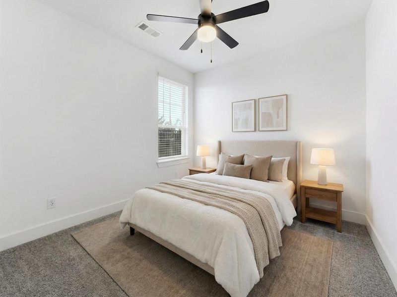 Virtually staged bedroom featuring baseboards and ceiling fan
