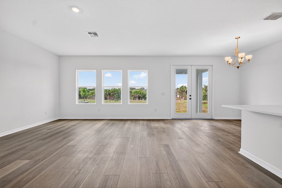 Representative unfurnished interior of a home built from the Sebago by Ashton Woods in Catamaran Cove, Rockledge (Image 7).