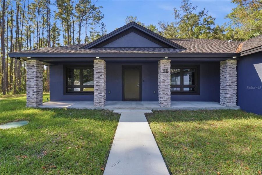 Front exterior of a new home in , Citrus Springs, FL, highlighting curb appeal (Image 30). Front exterior of a new home in , Citrus Springs, FL, highlighting curb appeal (Image 30).