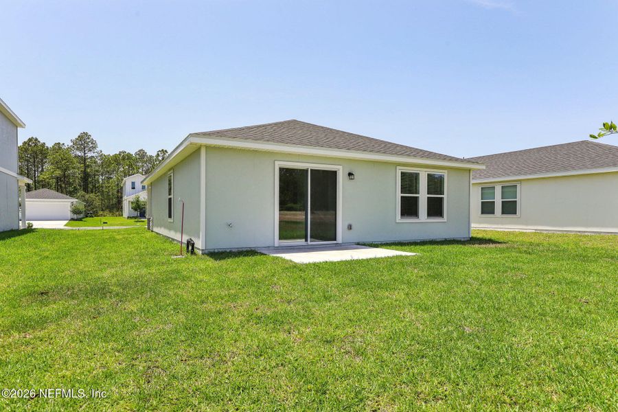 Exterior details and patio area of a home in Flagler Village - Classic Series, Palm Coast (Image 3).