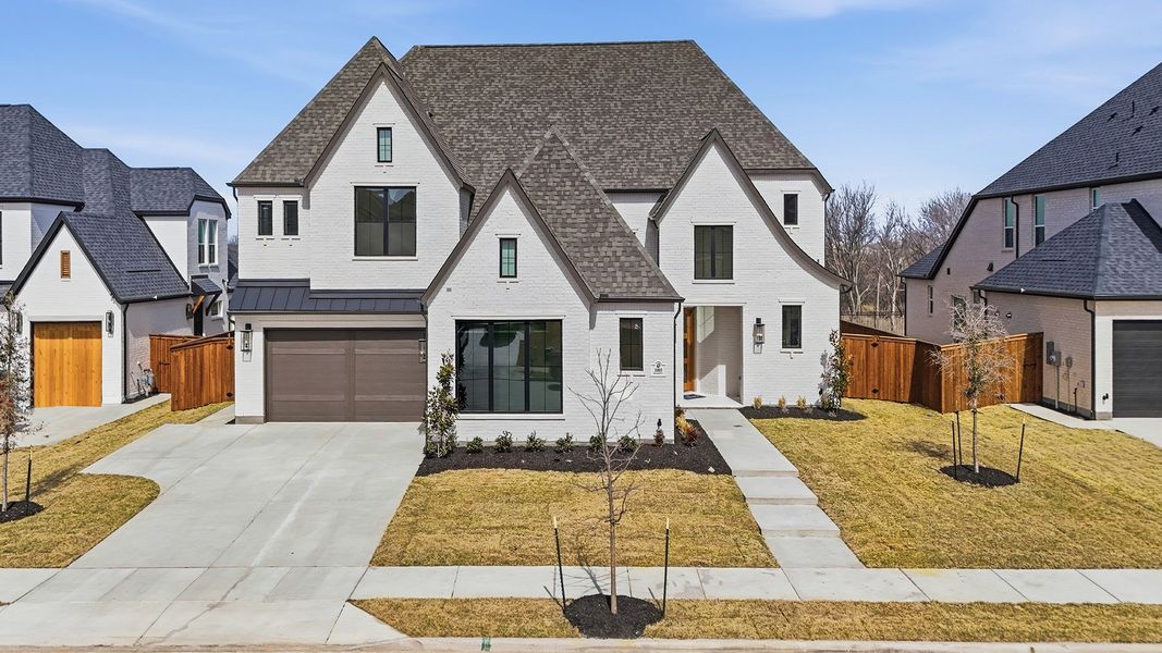 Front exterior of a new home in Light Farms Graham/Reagan, Celina, TX, highlighting curb appeal (Image 26).