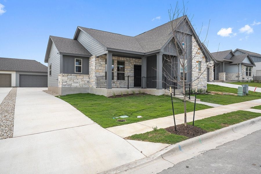 Front exterior of a new home in Sage Hollow, Kyle, TX, highlighting curb appeal (Image 1). Front exterior of a new home in Sage Hollow, Kyle, TX, highlighting curb appeal (Image 1).