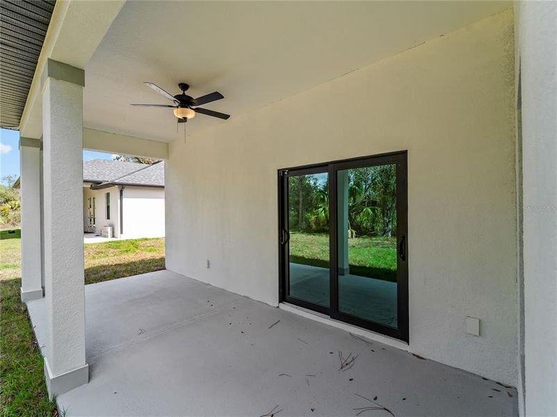 Exterior details and patio area of a home in , North Port (Image 39).