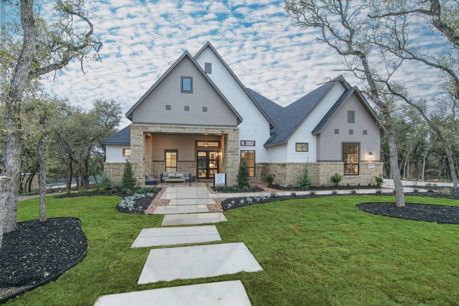 Front exterior of a new home in Heimer Estates at Garden Ridge, Fulshear, TX, highlighting curb appeal (Image 9).