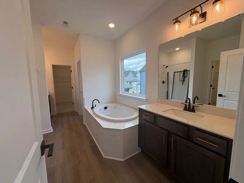 Primary Bath featuring AW Collection® Oxford - Organic textures paired with bold, classic design. Primary Bath featuring AW Collection® Oxford - Organic textures paired with bold, classic design.