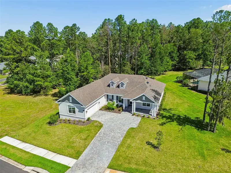 Front exterior of a new home in Southern Hills Plantation, Brooksville, FL, highlighting curb appeal (Image 2). Front exterior of a new home in Southern Hills Plantation, Brooksville, FL, highlighting curb appeal (Image 2).