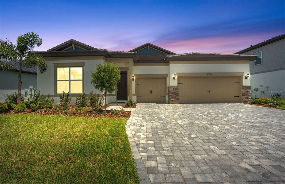 Front exterior of a new home in Two Rivers, Zephyrhills, FL, highlighting curb appeal (Image 1).