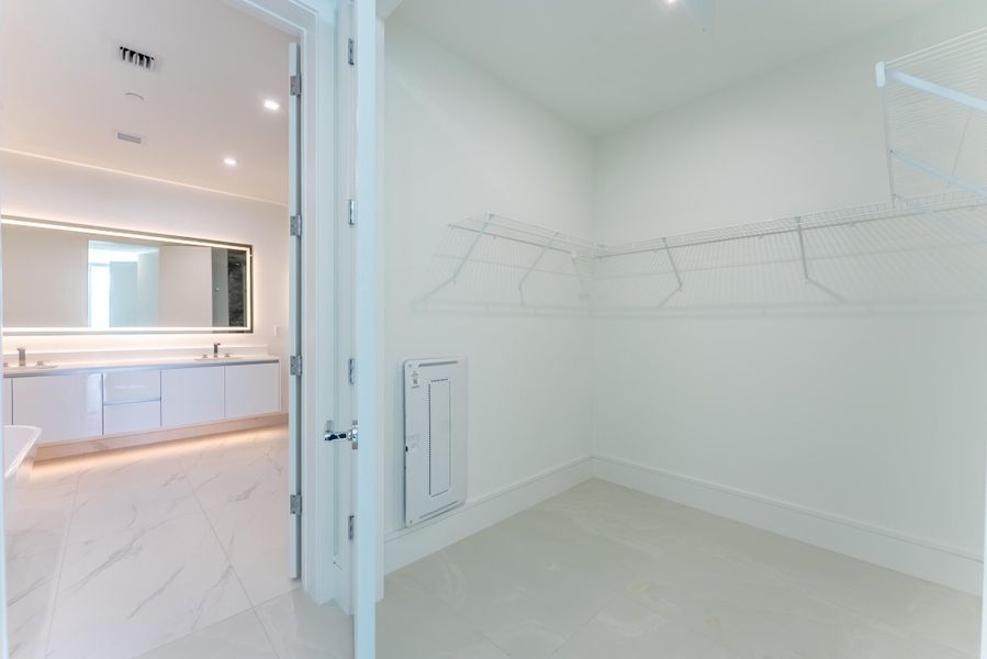 Primary Walk-In Closet Primary Walk-In Closet