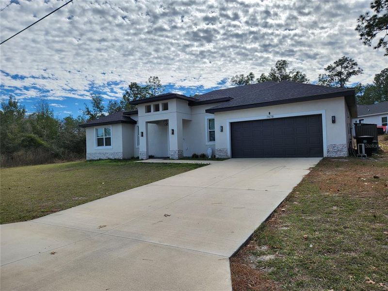 Front exterior of a new home in , Ocala, FL, highlighting curb appeal (Image 31).
