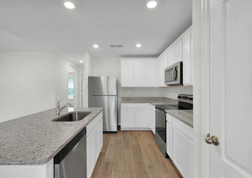 The kitchen comes with a full suite of energy-efficient appliances!