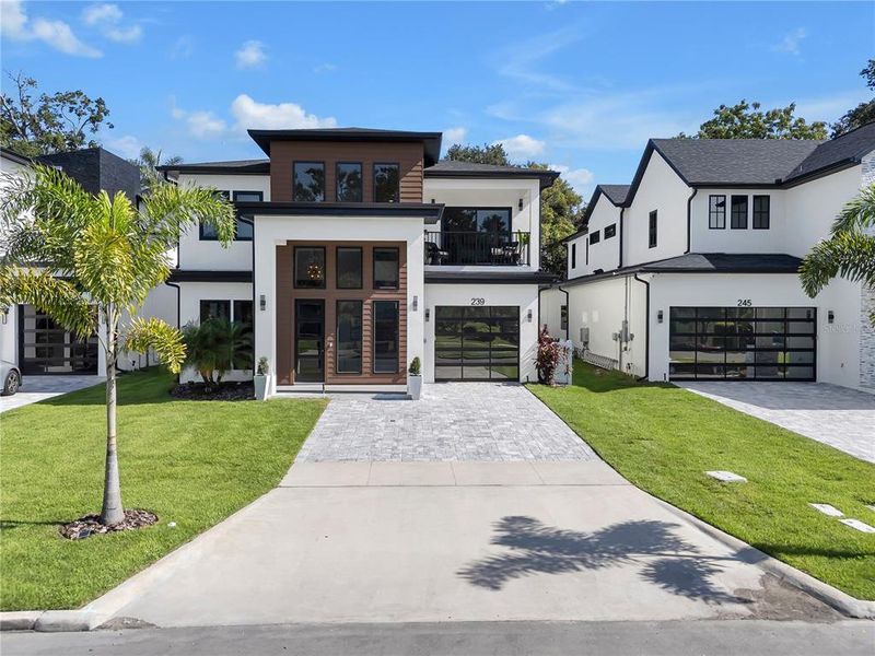 Front exterior of a new home in , Orlando, FL, highlighting curb appeal (Image 2).