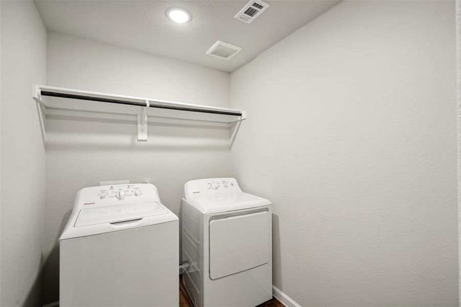 Laundry area with washer and clothes dryer