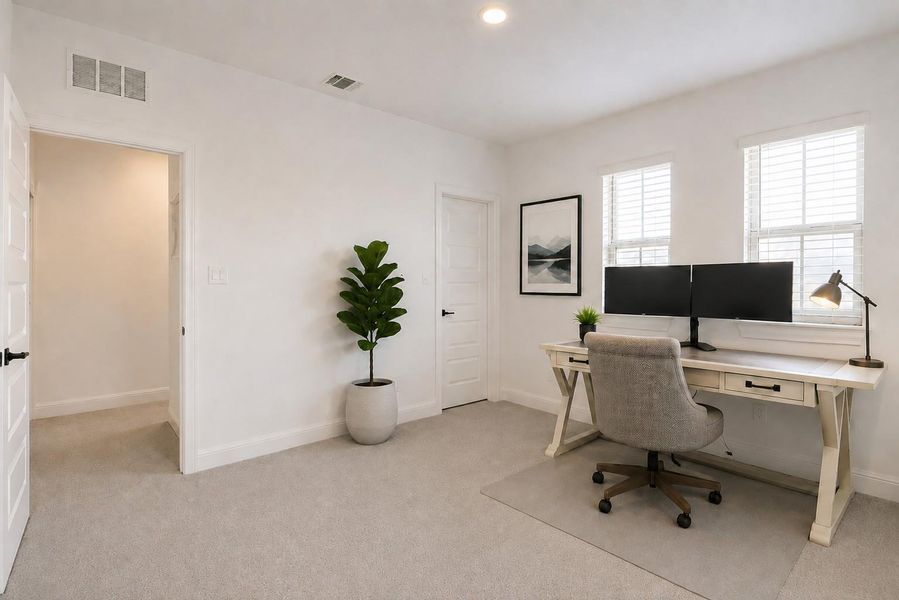 Well-lit and tranquil, this adaptable room presents an ideal setting for a home office or creative space. Well-lit and tranquil, this adaptable room presents an ideal setting for a home office or creative space.