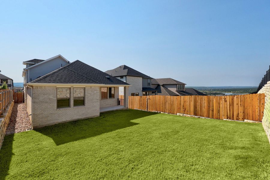 Exterior details and patio area of a home in Lakeside at Tessera, Lago Vista (Image 26).