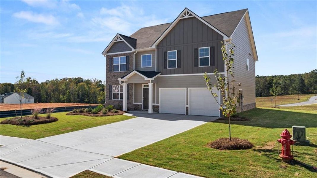 Front exterior of a new home in Locust Grove Station - Cedar Ridge, Locust Grove, GA, highlighting curb appeal (Image 1).