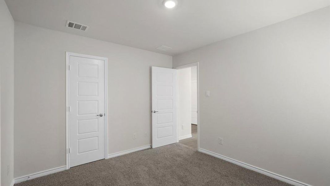 Wall-to-wall carpeting and neutral wall tones