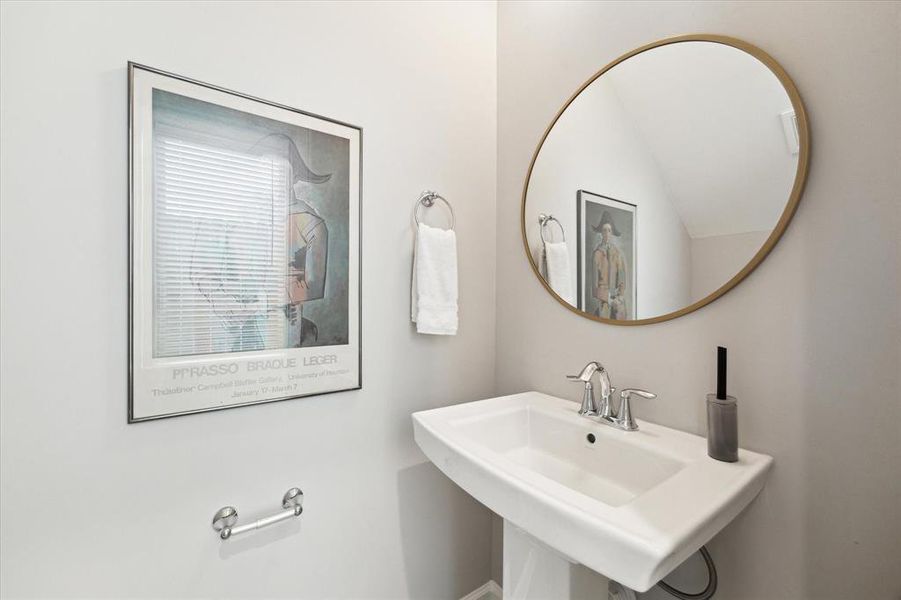 Powder room conveniently located off of the entry hall.