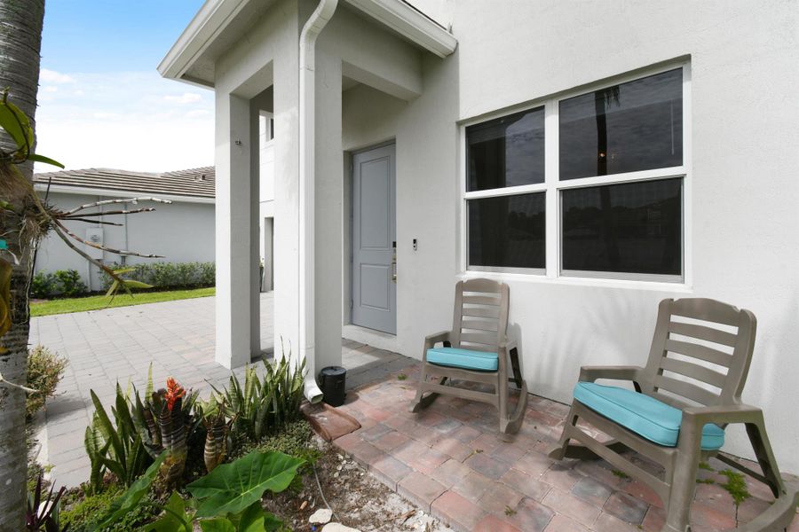 Front exterior of a new home in Reserve at Jupiter, Jupiter, FL, highlighting curb appeal (Image 23).