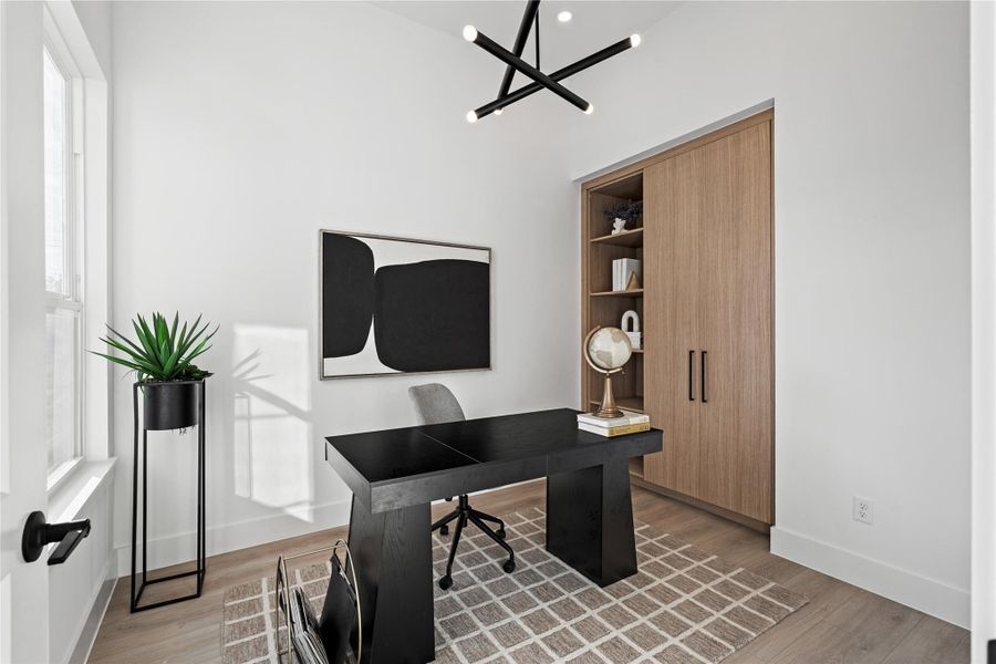 Natural light, custom millwork, and sculptural lighting define this versatile bedroom or study. It’s a space that balances productivity with polish, seamlessly woven into the home’s design story.