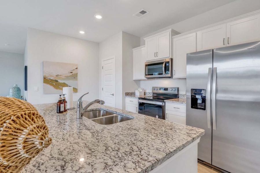 Representative furnished interior of a home built from the TUSCAN by D.R. Horton in Westbrook Retreat Villas at Savannah Quarters, Pooler (Image 4).